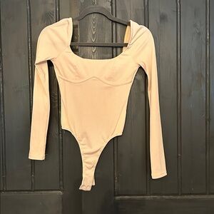 NEW.  kittenish body suit.